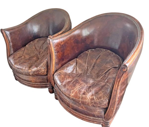 Vintage pair of leather tub armchairs